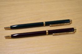 Two Waterman Gentleman ballpoint pens in Green, and Burgundy Laque