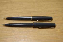 A Parker 45 ballpoint pen and propelling pencil in grey