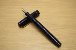 A Mabie Todd & Co Swan 200/60 lever fill fountain pen in black with chaised design having gold