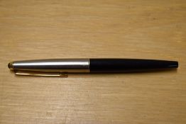 A Parker 45 cartridge fill fountain pen in black with lustraloy cap with gold trim