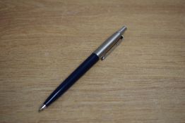 A Parker Jotter ballpoint pen in dark blue with metric converter
