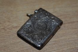 A hallmarked silver vesta case decorated with acanthus leaf and initials L B, h4.5cm