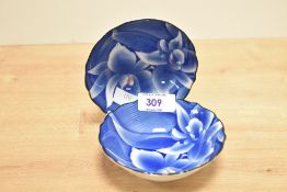 A pair of 20th century Japanese Fukugawa blue orchid bowls having scalloped edges and floral