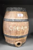 A Moira stoneware spirit flask, modelled as a coopered wooden barrel having scripted label