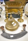 A brass wall bell, h12.5cm, sold together with a pair of a pair of candlesticks and a herb chopper