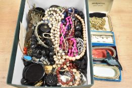 A collection of costume jewellery, including beaded necklaces, faux pearls, brooches and statement