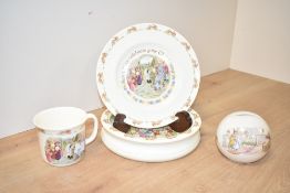A Royal Doulton Bunnykins Christening plate, h20cm, sold together with a Bunnykins mug, piggy bank