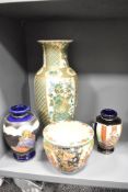 A large Japanese vase in baluster form decorated with exotic birds in green and gilt colour,