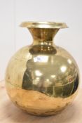 A large eastern brass bulb shaped vessel, h34