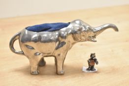An elephant figure pin cushion, h9cm, sold together with a miniature bear pin cushion, (2)