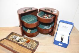 A wooden jewellery box, of cylindrical form with a painted rectangular box, containing a