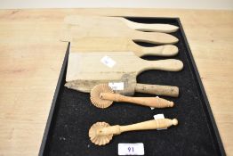 A pair of wooden pastry siggers having fluted wheels L13.5cm, sold together with 4 Scotch hands/