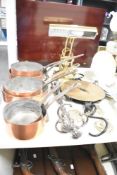 A set of 6 early 20th century copper pans, largest w22cm, sold together with a brass bankers lamp, a
