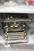 An early 20th century black Imperial type writer , the front reading, 'British Right Through',