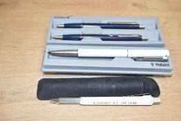 A Parker Vector ballpoint pena nd propelling pencil set with aParker Rialto advertising ballpoint