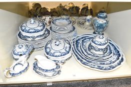 A Royal semi porcelain dinner service, decorated with blue floral patterns on a white ground, to