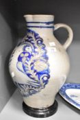 A late 18th / eary 19th century Westerwald flagon having shaped spout and handle, decorated with