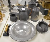 An Art & Crafts pewter 3 piece tea set of baluster form, having rattan handle, impressed mark
