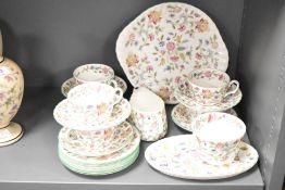 A Minton Haddon Hall pattern fine bone china tea service, decorated with floral patterns on a