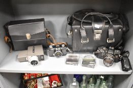A Chinon CE-5 camera with leather carry bag, sold together with a Chinon 35 EE camera, a Crestline