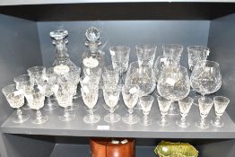A cut crystal decanter of baluster form having stopper and enamel sherry label, h23cm, sold together
