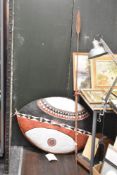A African oval sheild, hand decorated on buffalo skin with geometrical patterns, L90cm