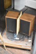 A Lenco turntable with bluetooth reception and wooden speakers.