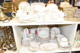 A St Michael Harvest pattern dinner service, decorated with floral patterns, to include tea pot,