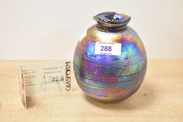 A John Ditchfield for glassform hand blown iridescent art glass of circular form, signed to base, No