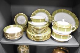 A Noritake Eroica pattern dinner service, decorated with gold and green colour edging on an ice