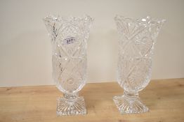 A pair of cut crystal tulip vases supported on a square base, h26cm