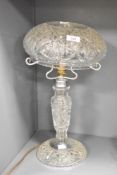 A large cut crystal mushroom lamp, having geometrical patterns and circular base, h44cm