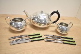 A silver plated tea pot, sold together with 6 Zenith butter knives a cream jug and a twin handled
