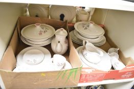 A Royal Doulton Pillar Rose pattern dinner service decorated with floral patterns on a ice white