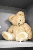 A vintage fully jointed soft toy bear with glass eyes, h40cm
