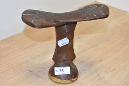 An African tribal wooden head rest with stud work decoration, h16.5cm