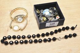 A small collection of costume jewellery, including wristwatches, brooches and clip-on earrings