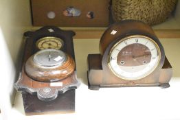 A early 20th century oak circular barometer, h16cm, sold together with 2 oak clocks, (3)