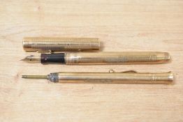 A 9ct gold Mabie Todd & Co Swan lever fill fountain pen and part propelling pencil, both engraved.
