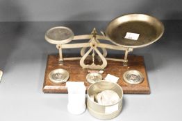 A Johnson's of Hendon Ltd weighing scale with weights, L21cm