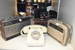 A Polaroid Instant 10 camera, w14cm, sold together with a Zenit TTL camera, a Ingelen radio, a