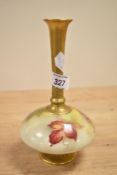 A hand painted Royal Worcester porcelain vase having fluted neck, decorated with berries and foliage
