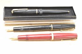 Two Parker Fountain pens and a Ballpoint pen. A Parker Duofold in red, a Parker Junior Duofold in