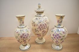 A late 19th Royal Bon style lidded vase hand painted with floral patterns and gilt edging, h32cm,