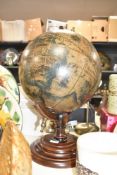 A world globe raised on a circular stepped base, H53cm