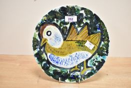 A ceramic plate hand painted with stylised chicken, w23cm