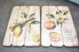 A pair of wall plaques decorated with lemons and foliage, h46cm
