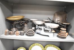 A group of cast iron weighing scales, ( 4 ), to include weights.