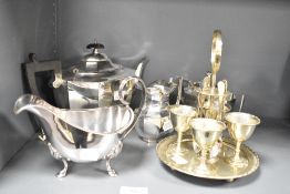 A silver plated 4 piece egg cruet set with spoons, h21cm, sold together with a silver plated sugar