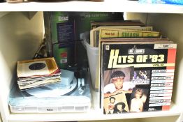 A Tevion USB turntable, sold together with various records, to include Hits of' 83, The Hits Album 7